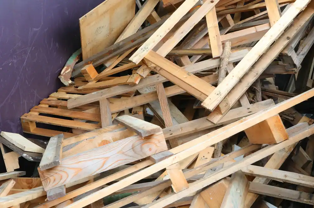 Pallet King wooden pallet scrap pile for recycling or repurposing.